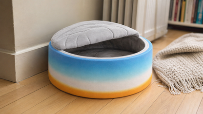 Covered cat bed in the corner of a living room
